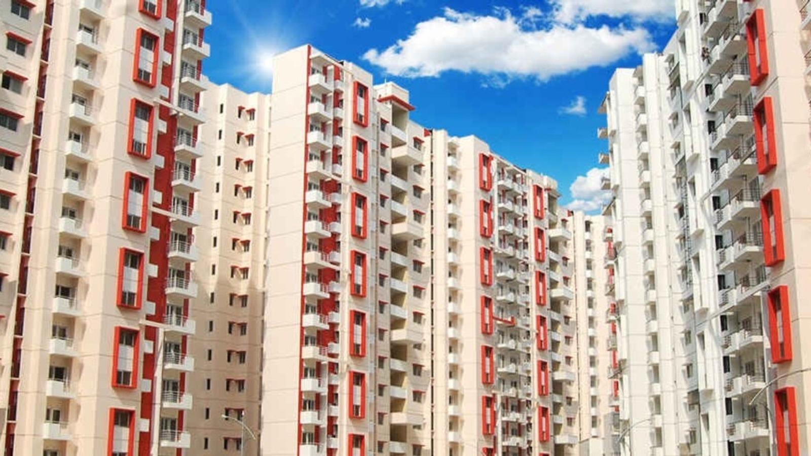 Urban development and housing projects in India showing modern apartment buildings