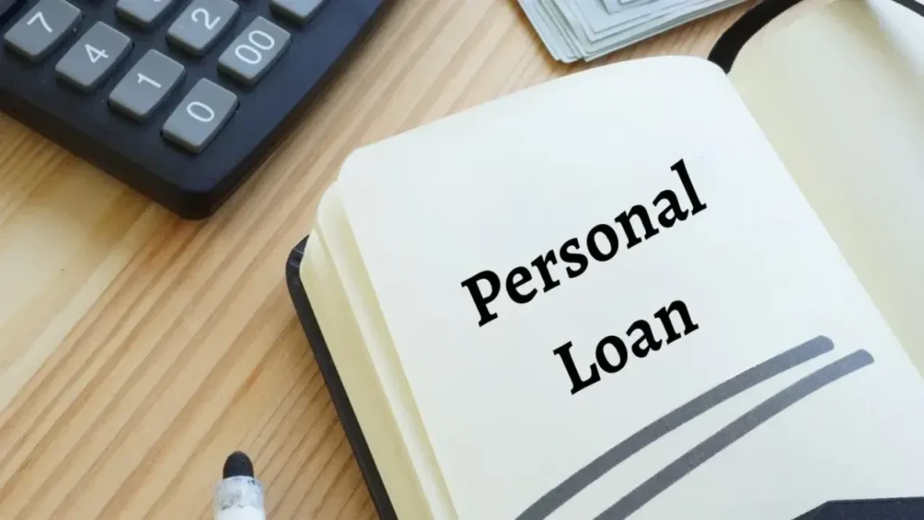 Personal Loan Approval Tips image showing notebook and calculator for loan planning