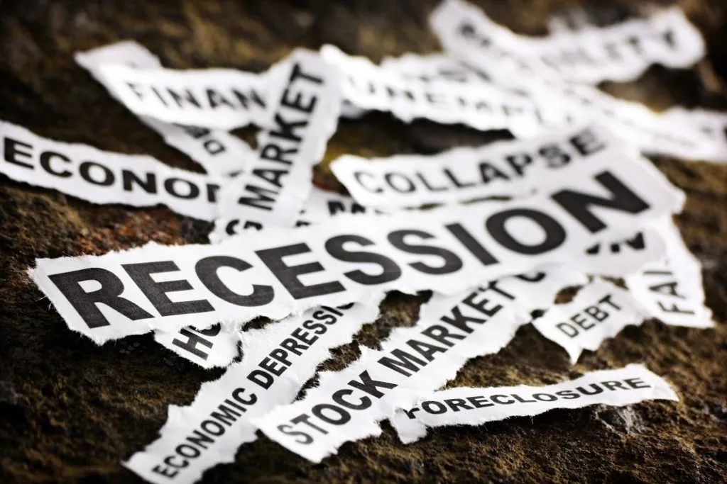 What is a recession showing economic slowdown, falling GDP, job losses and financial stress in the economy